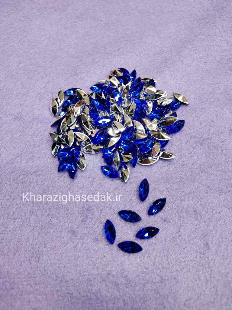 <ul> <li><em><strong>کیفیت : جنس درجه یک و رنگ های زیبا</strong></em></li> <li><em><strong>مناسب برای تاج سازی و جواهر سازی و گلسازی و...</strong></em></li> <li><em><strong>فروش بصورت بسته ی 50 عددی میباشد</strong></em></li> <li><em><strong>فروش بصورت عمده هم امکان پذیر است.</strong></em></li> <li><em><strong>در رنگ های جذاب و متنوع موجود میباشد.</strong></em></li> </ul> نگین پلاستیکی مارکیز 7 در 15 - تصویر 7